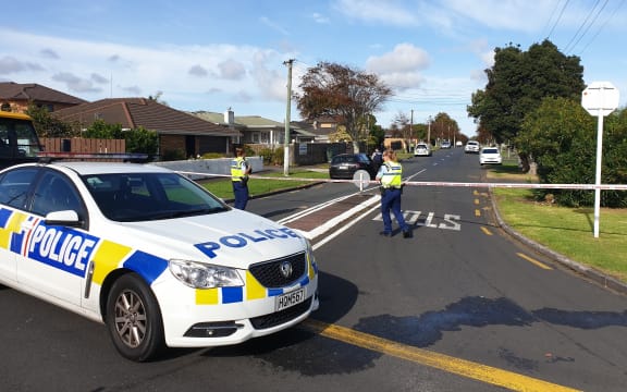 Police at Central Avenue in Papatoetoe after a man wielding a machete was shot dead.