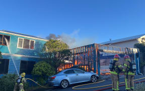 Firefighters at the scene of a house fire in Island Bay, Wellington, 3 November 2025.