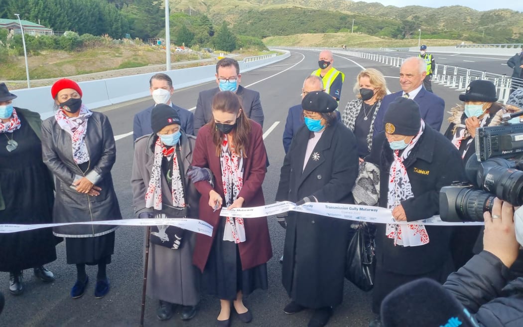 Prime Minister Jacinda Ardern cuts the ribbon on Transmission Gully during the opening ceremony, 30 March 2022.