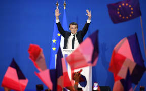 Emmanuel Macron speaking to supporters after the first round of voting in the French presidential election.