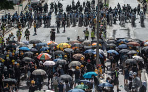 Protesters and police face-off at Harcourt Road.