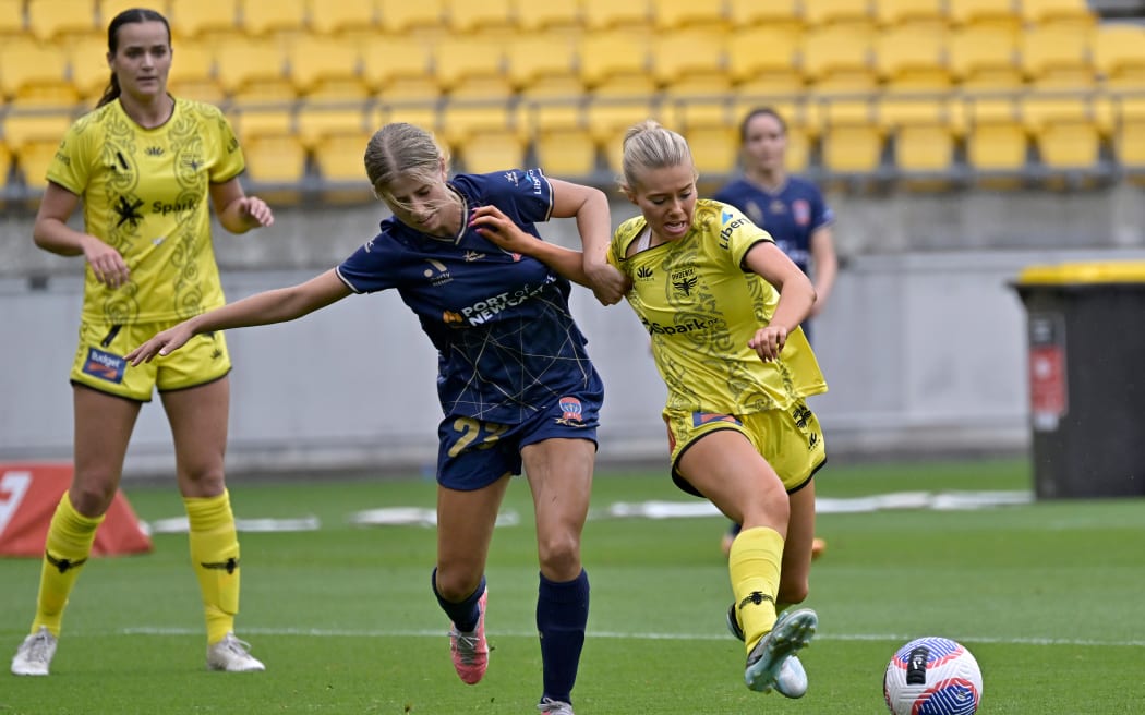 Alyssa Whinham of the Phoenix and Zoe Karipidis of the Jets compete for the ball during the Wellington side's 2-nil win.