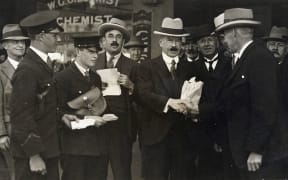 Joseph Ward receiving congratulations after 'accidentally' winning the 1928 election.