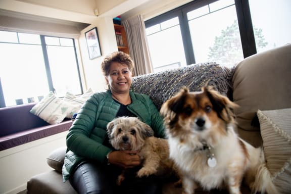 Breast cancer survivor Maria Marama with her two dogs Kahu and Kyle