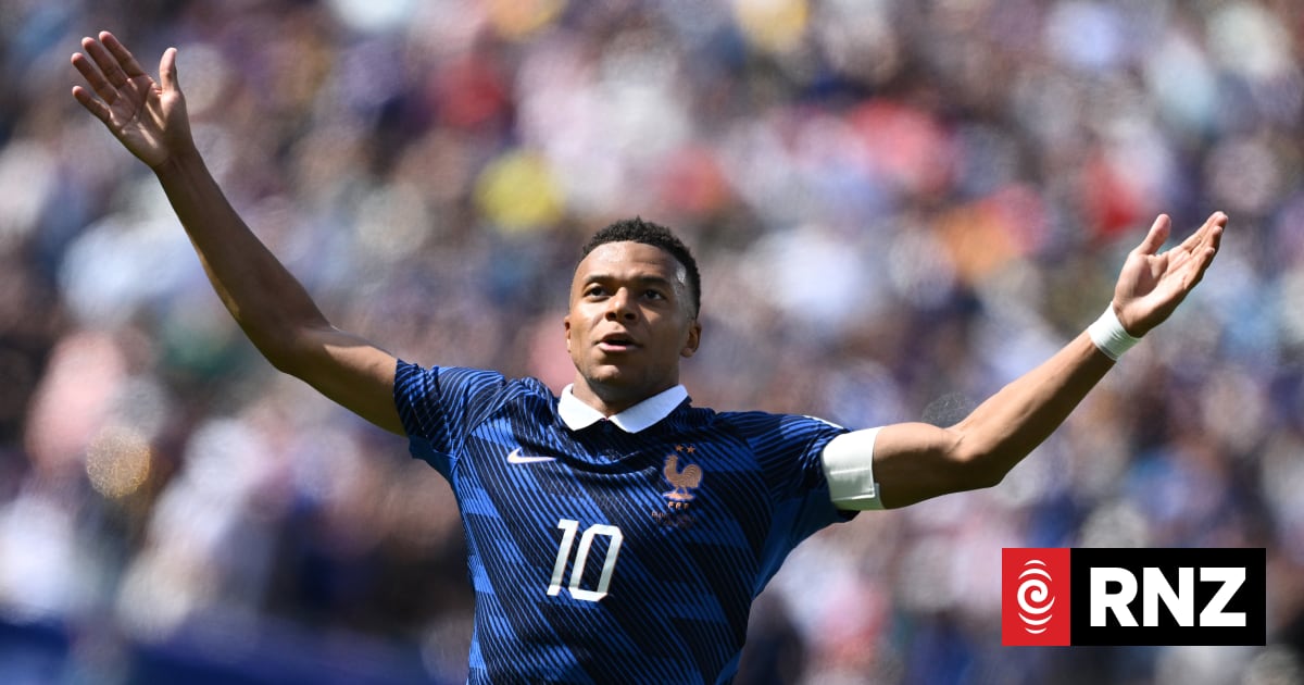 Kylian Mbappe scores twice as France beat Iraq at World Cup after two-hour storm delay