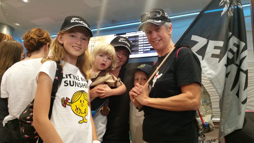 These fans at Auckland International Airport want the Black Caps to know they have done New Zealand proud.
