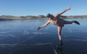 Dunedin's Keith Dickson ice skating in the near-nude to celebrate his 73rd birthday.