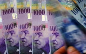 Switzerland's central bank is bringing in a negative interest rate in an attempt to lower the value of the country's franc.