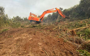 Heavy machinery was brought in to widen an existing track and create firebreaks, as well as around orchards, around Kaimaumau village on 20 December, 2021.