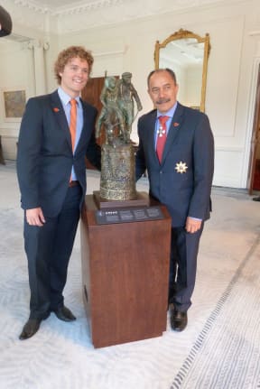 Sam Johnson, organiser of the Student Volunteer Army, left, and Governor General Sir Jerry Mateparae, with 'The Governor General's ANZAC of the Year Trophy.