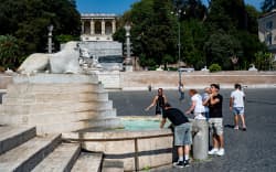 People cool off during an ongoing heat wave with temperatures reaching 40 degrees at Piazza del Popolo in Rome, Italy, on July 6, 2025.