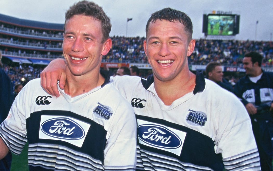 Adrian Cashmore and Carlos Spencer celebrate the win, Super Rugby final between the Blues and Sharks at Eden Park, May 1996.

Copyright photo: www.photosport.nz