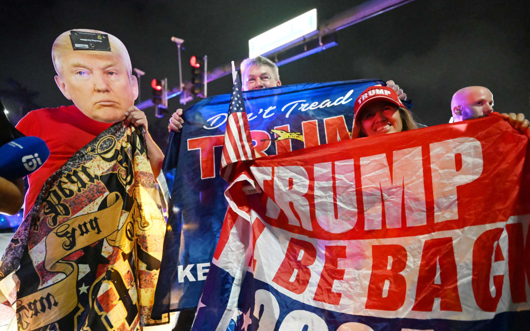 Republican supporters react after Donald Trump declares victory in the US election in West Palm Beach, Florida on November 6, 2024.( The Yomiuri Shimbun via AP Images ) (Photo by Kouhei Chouji / Yomiuri / The Yomiuri Shimbun via AFP)
