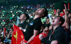 LGD fans react during the Dota 2 grand final match between PSG.LGD and OG on Day 6 of The International 2018 at Rogers Arena on August 25, 2018 in Vancouver, Canada.