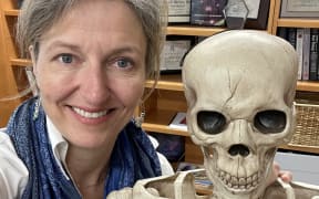 Professor Laura McCabe and her favourite skeleton.