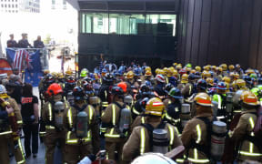 About 160 firefighters gathered to climb Auckland's Sky Tower in commemoration of the firefighters who died during 9/11.