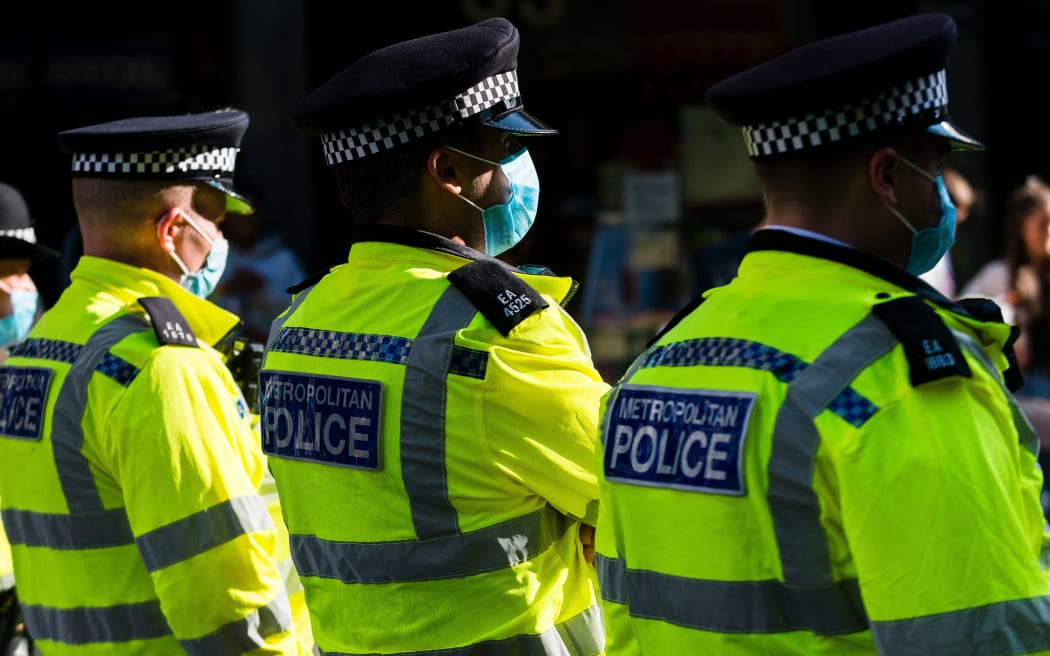 Police officers at an Extinction Rebellion protest in London, Britain, 23 August 2021. Climate action group Extinction Rebellion (XR) are planning to hold multiple actions over two weeks from August 23rd 2021