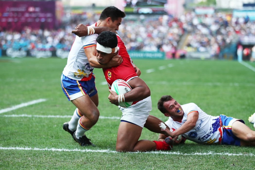 Tonga's Josh Moala-Liava'a charges through the Philippines defence during the World Series Qualifier in Hong Kong.