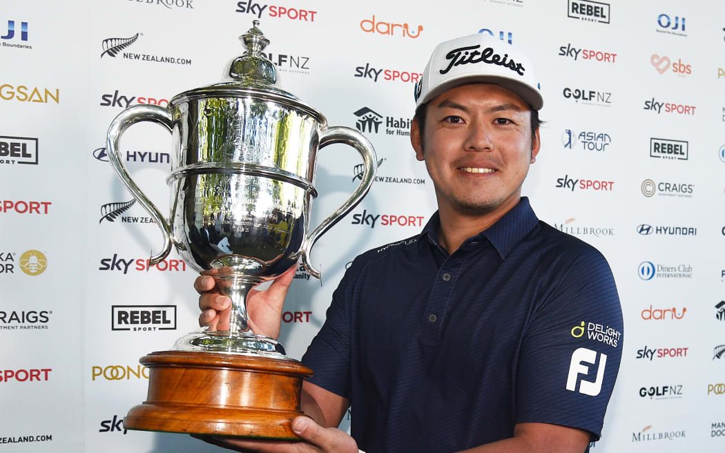 Takahiro Hataji with trophy after winning Round 4 at the 103rd New Zealand Open.