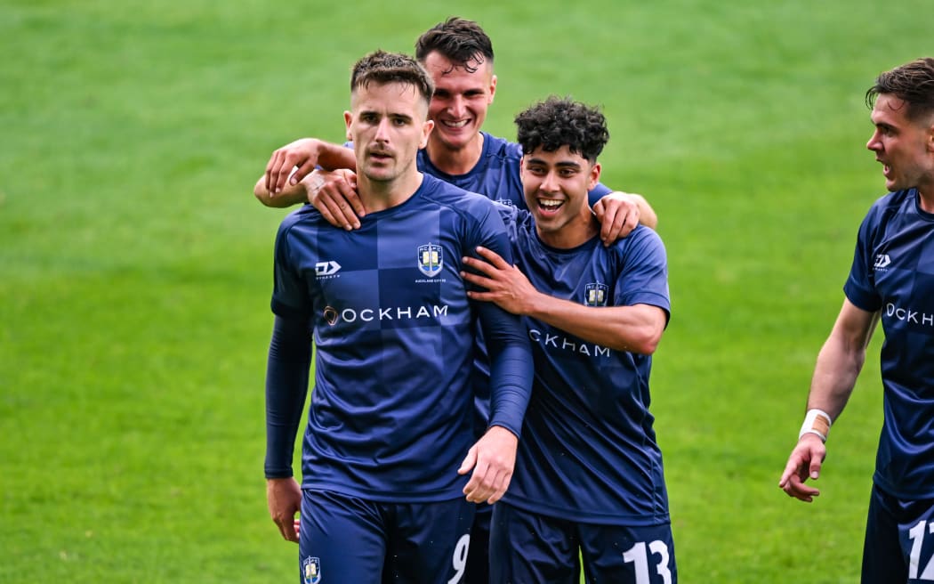 Angus Kilkolly of Auckland City FC celebrates his goal with Nathan Lobo.