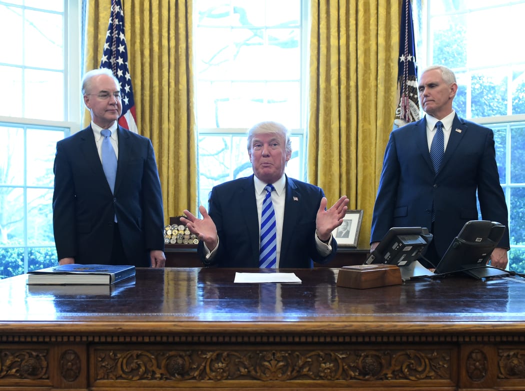 US President Donald Trump, with Vice President Mike Pence and Health and Human Services Secretary Tom Price, speaks from the Oval Office of the White House in Washington DC after his healthcare bill was pulled.