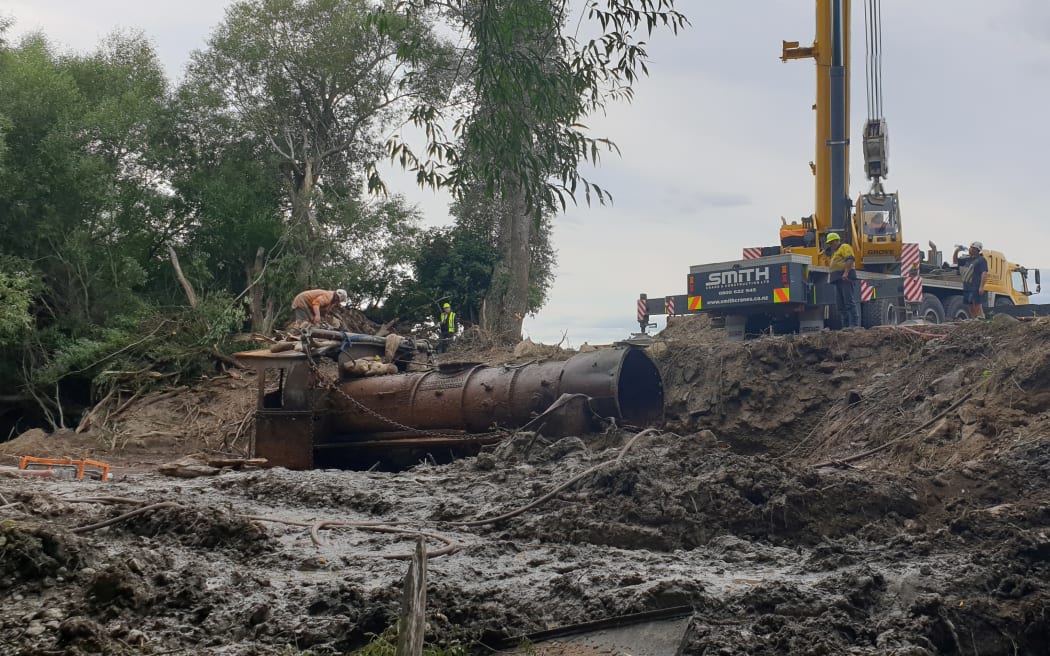 The locomotives were filled with tonnes of silt and river muck, so hauling them out required a huge effort.