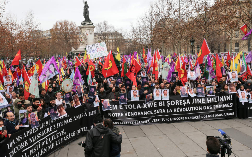 Hundreds of members of the Kurdish community demonstrate at the Place de la Republique in Paris on December 24, 2022, a day after a gunman opened fire at a Kurdish cultural centre killing three people.
