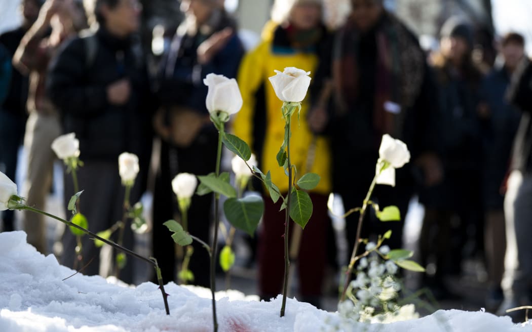 MINNEAPOLIS, MINNESOTA - JANUARY 07: Flowers are placed at the site where a woman was reportedly shot and killed by an ICE agent during federal law enforcement operations on January 07, 2026 in Minneapolis, Minnesota. According to federal officials, the agent, "fearing for his life" killed a woman during a confrontation in south Minneapolis.   Stephen Maturen/Getty Images/AFP (Photo by Stephen Maturen / GETTY IMAGES NORTH AMERICA / Getty Images via AFP)