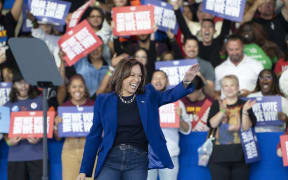 US Vice President and Democratic presidential candidate Kamala Harris waves as she arrives to speak during a campaign rally at Talking Stick Resort Amphitheatre in Phoenix, Arizona, on October 31, 2024. (Photo by Rebecca NOBLE / AFP)