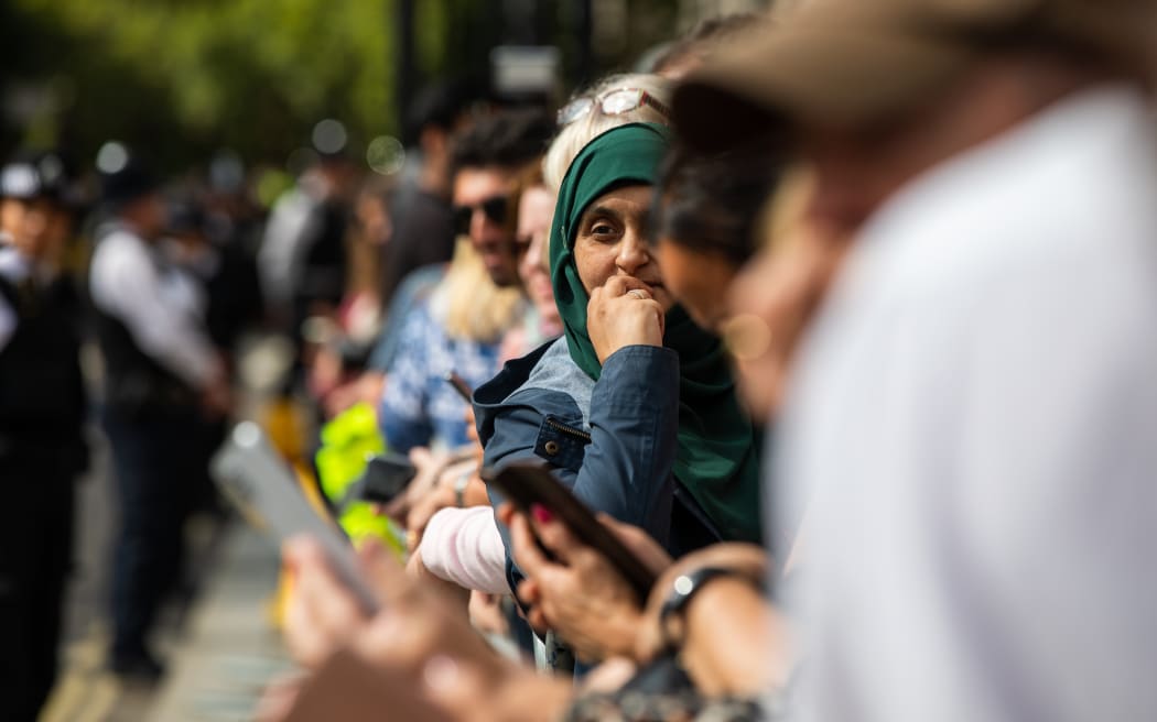 Crowds gather to view the Queen to be laid in state
