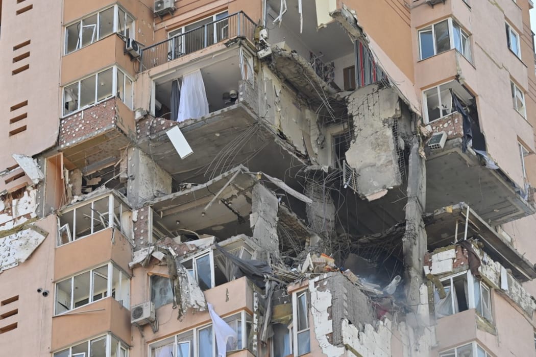 A view of a high-rise apartment block which was hit by recent shelling in Kyiv on February 26, 2022.
