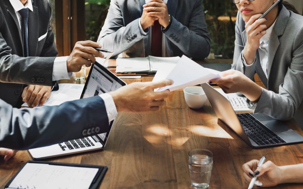 business people around a desk
