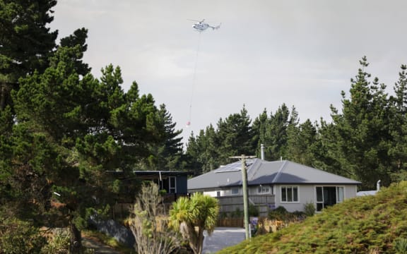 Fire and Emergency crews respond to a blaze at Pines Beach, near Kaiapoi north of Christchurch, on 25 January.