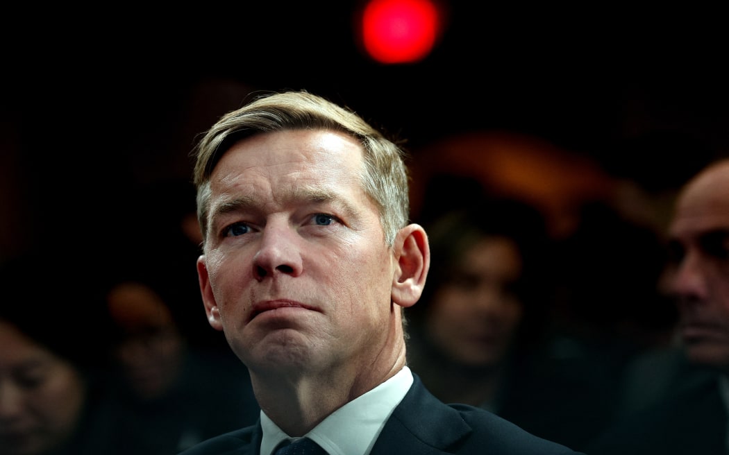 WASHINGTON, DC - NOVEMBER 17: McDonald's President and CEO Chris Kempczinski listens as U.S. President Donald Trump delivers remarks at the McDonald’s Impact Summit at the Westin DC Downtown on November 17, 2025 in Washington, DC. Trump spoke on the economy and highlighted his One Big Beautiful Bill Act, including its provisions for tax breaks on tips and overtime as he addressed the group of McDonald’s restaurant franchise owners.   Win McNamee/Getty Images/AFP (Photo by WIN MCNAMEE / GETTY IMAGES NORTH AMERICA / Getty Images via AFP)