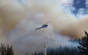 This photo was taken shortly before helicopters had to be grounded because of unauthorised drone activity in the area. Helicopter fighting the Lee Valley fire on 7 February 2024.