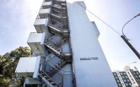The lift at Pukehinau Flats in Wellington has been broken for the past week, forcing its residents to walk up a large number of steps to get to their apartments. The lift is not expected to be fixed until January.