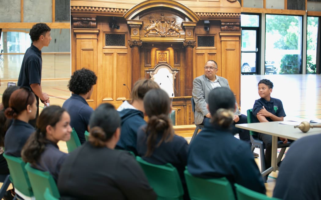 A student role-playing as the Prime Minister makes his opening remarks during the mock debate.