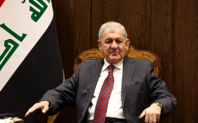 A handout picture released by the Iraqi parliament on 13 October 2022 shows presidential candidate Abdul Latif Rashid attending a parliamentary session during which a new president is due to be elected.