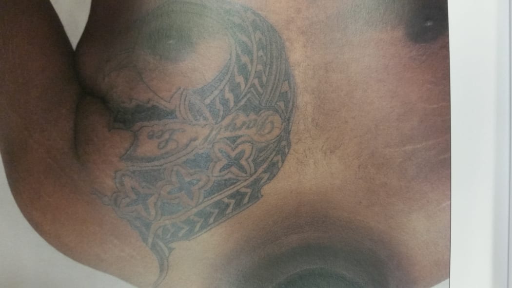 A page in an evidence booklet in court, showing one of the two tattoos referred to by a witness in court today.