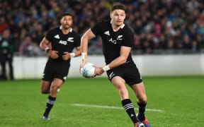 Beauden Barrett makes a break with Richie Mo'unga in support.