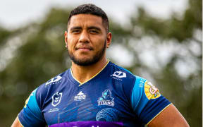 The NRL Gold Coast Titans Kalifa Faifai Loa wearing one of the jerseys they will be auctioning-off this Saturday with all proceeds being donated to Tonga relief funds. 14 June 2022