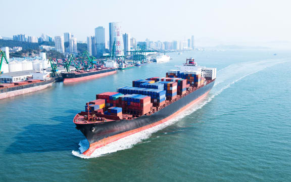 Large container ship arriving in port.
