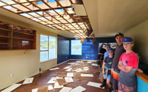 Members survey the damage at Taipā Sailing Club, in the Far North’s Doubtless Bay.