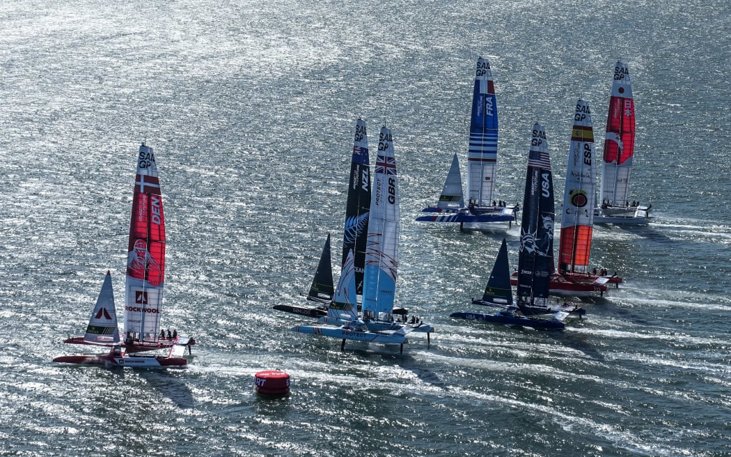 Boats on the start line of a SailGP race in San Francisco.