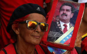 CARACAS, VENEZUELA - MARCH 10 : People gather in front of the Miraflores Palace during a meeting  in support of Venezuelan President Nicolas Maduro, in Caracas,  on March 10, 2019.
