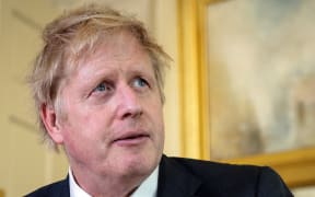 A handout image released by 10 Downing Street, shows Britain's Prime Minister Boris Johnson as he delivers a television address after returning to 10 Downing Street after being discharged from St Thomas' Hospital, in central London on April 12, 2020.