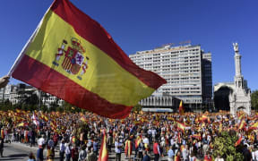 Protesters gather holding Spanish flags during a demonstration against independence of Catalonia.
