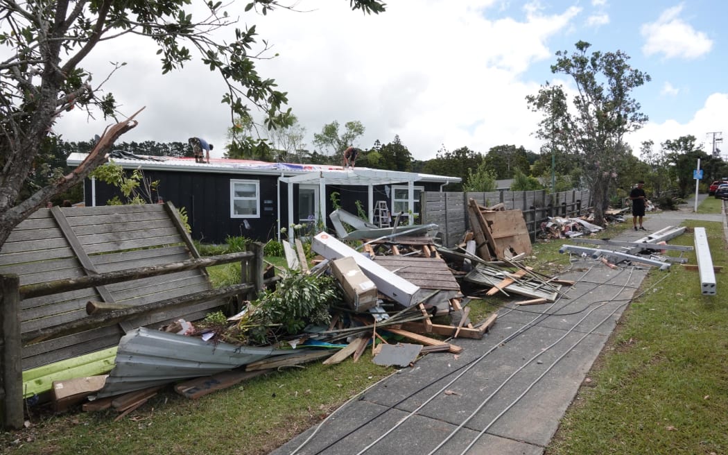 Debris, downed power lines on Old Waipu Rd
