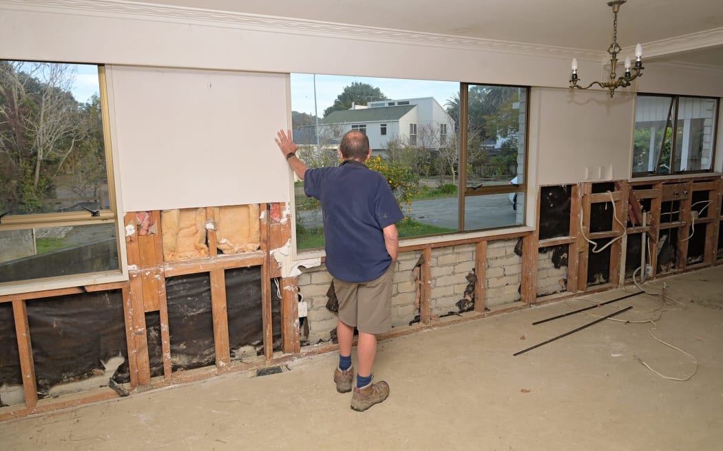 Ron looks out the window during a visit to the Vogel St home this week. The tenants were evacuated during Cyclone Gabrielle, and he remembers seeing them walk out with piles of clothes in their hands.