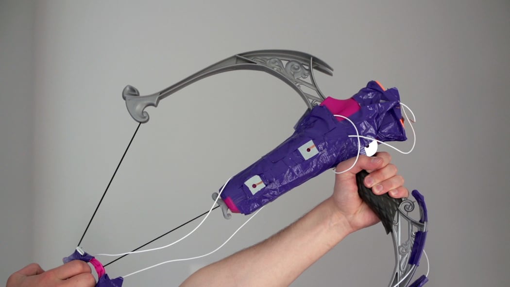 Dylan uses a Nerf bow as a contoller while playing Overwatch.